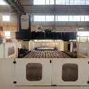 纽威PM3060HZ。工作台3X6米，门宽3.8米，门高1.6米。.